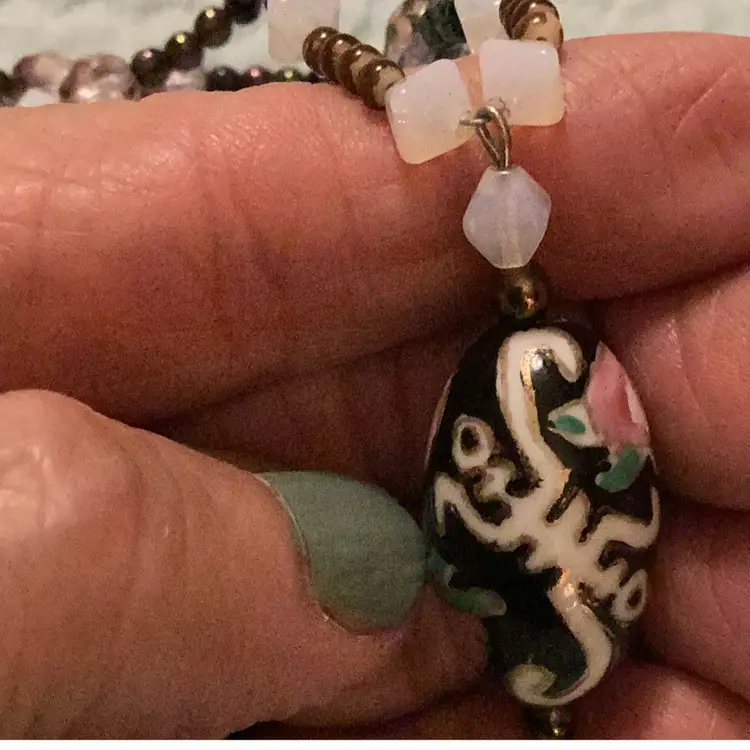 # 17 .  Oval Focal Point hand painted could be closing a not sure I think the beads might glow in the dark claw class