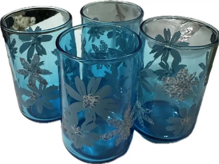 Vintage Libbey blue tumblers with a raised white floral design.