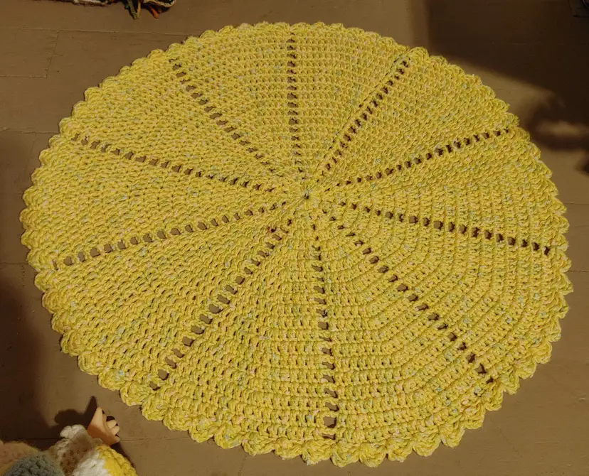 Crochet: Small yellow table cover. 22 inch diameter. 1 small spot. Should wash out.