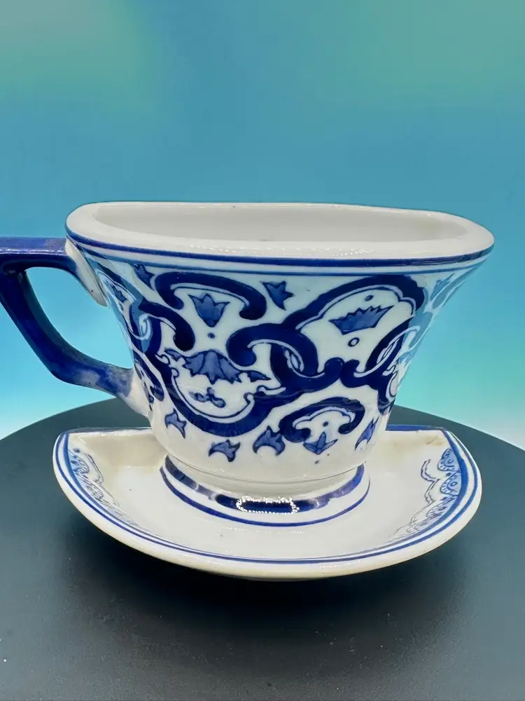 Vintage blue and white cup and saucer porcelain/ceramic wall pocket