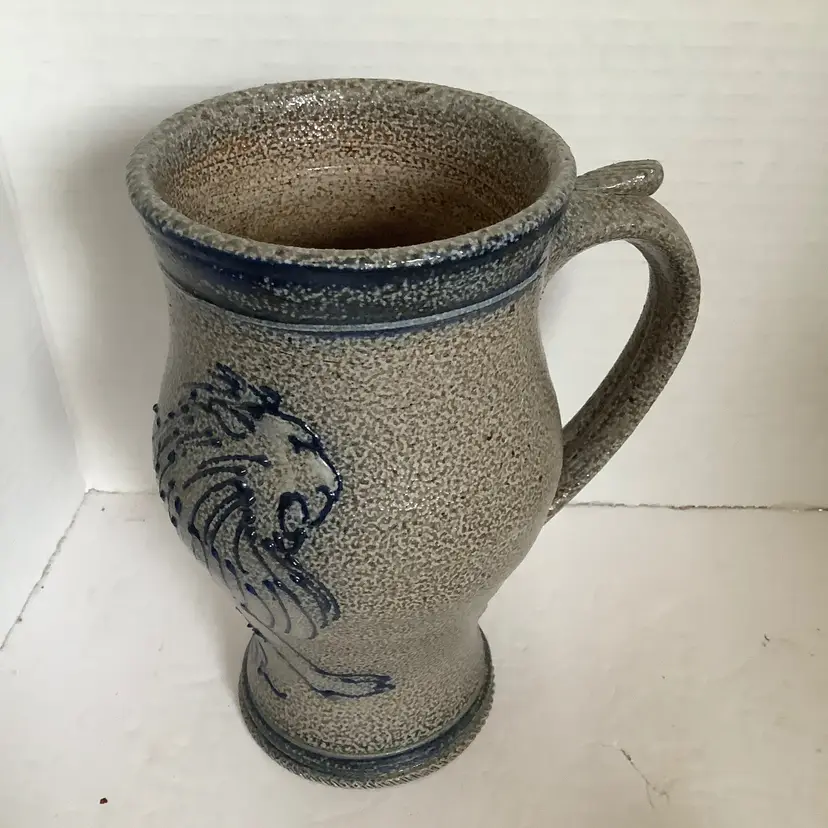 Large Salt Glaze stoneware mug with lion wrapping around it.