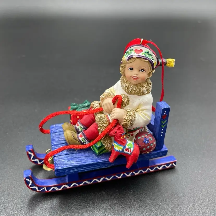 Scandinavian Style Resin Little Girl on Sled Hanging Christmas Ornament