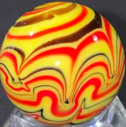 1 1/8" Signed Red Black Yellow Marble UV Glow Front And Back Photos