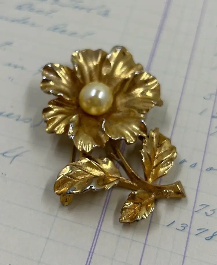 Gold tone Flower Pin With Pearl Type Bead In Center.