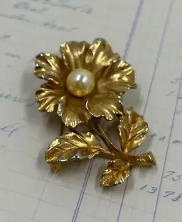 Gold tone Flower Pin With Pearl Type Bead In Center.
