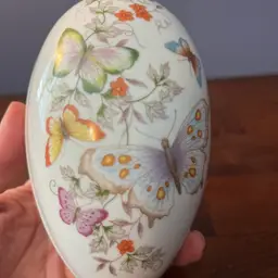 Vintage Avon fine porcelain decorated egg trinket box with butterflies. Circa 1974 6”