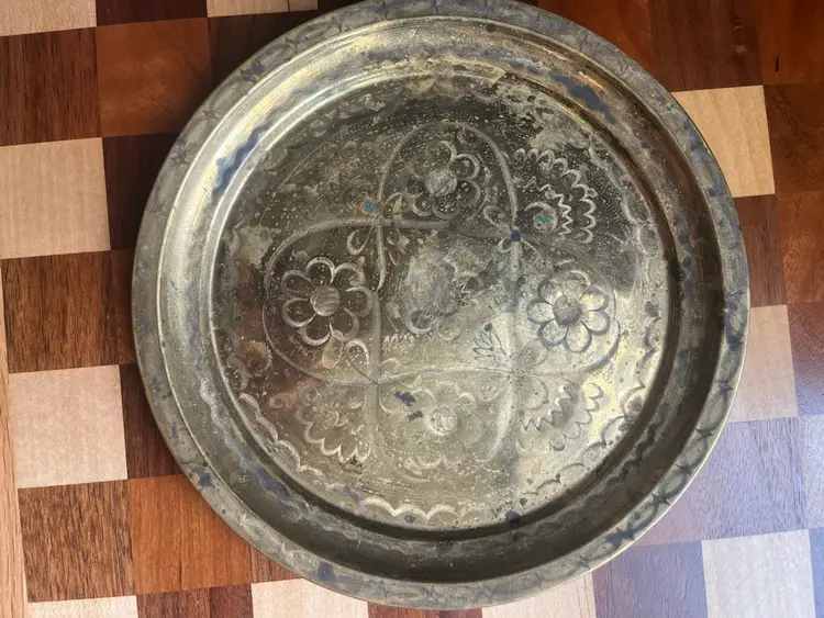 A vintage etched brass decorative tray with floral motifs. - 9”