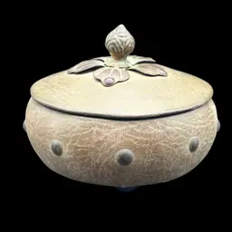 #181A Vintage Wooden Trinket Box Featuring a Textured Leather Covering With Decorative Studs Around The Bowl and a Metal Floral Finial on the Lid and Three Ball Feet