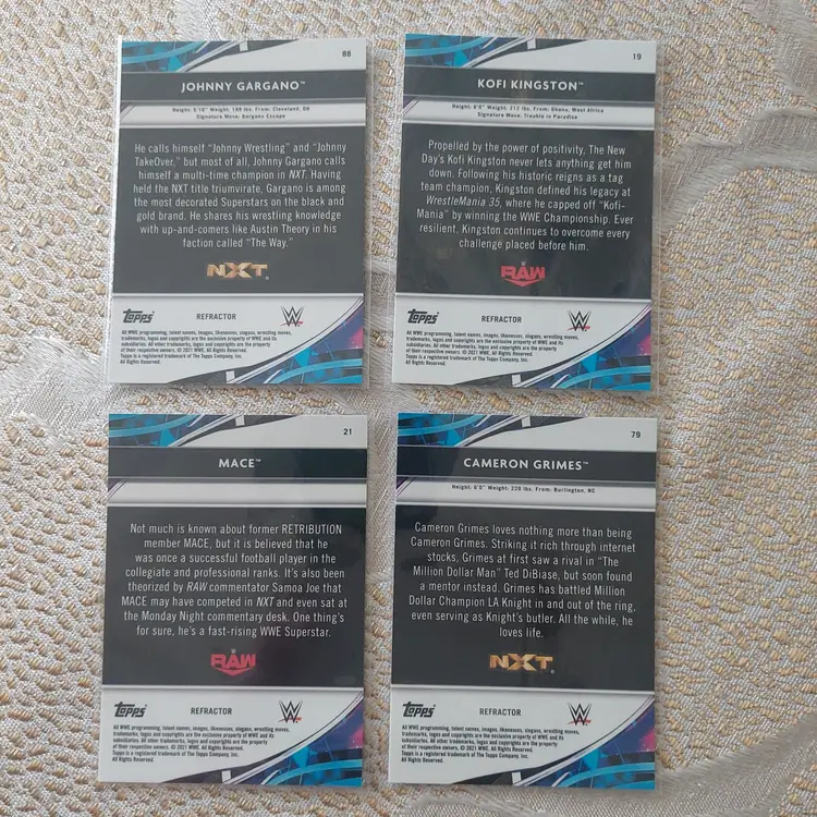 Lot of 4 WWE Finest Silver Refractors.