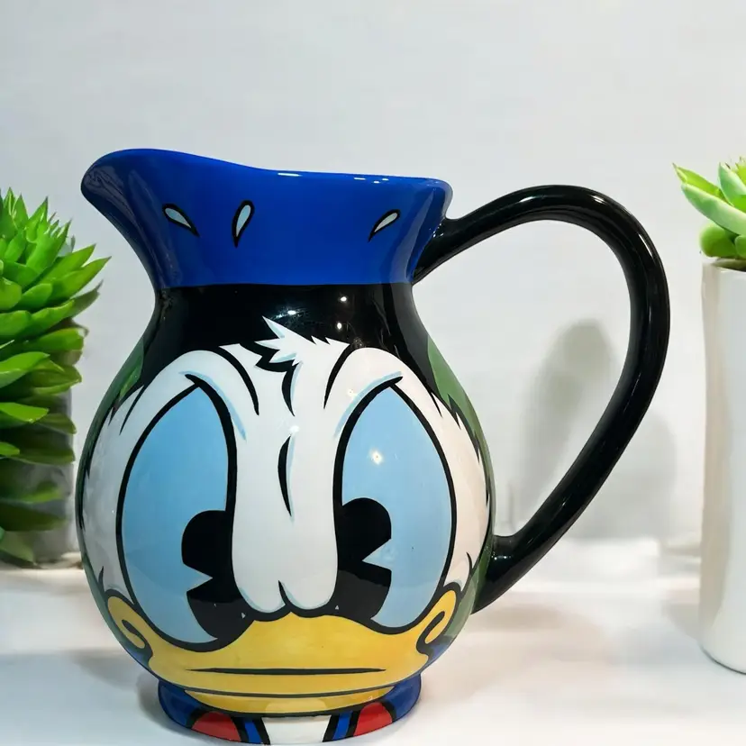 Art of Disney Donald Duck Angry Duck Porcelain Water Pitcher AS IS
It has a pretty significant crack on the back side. See pics.