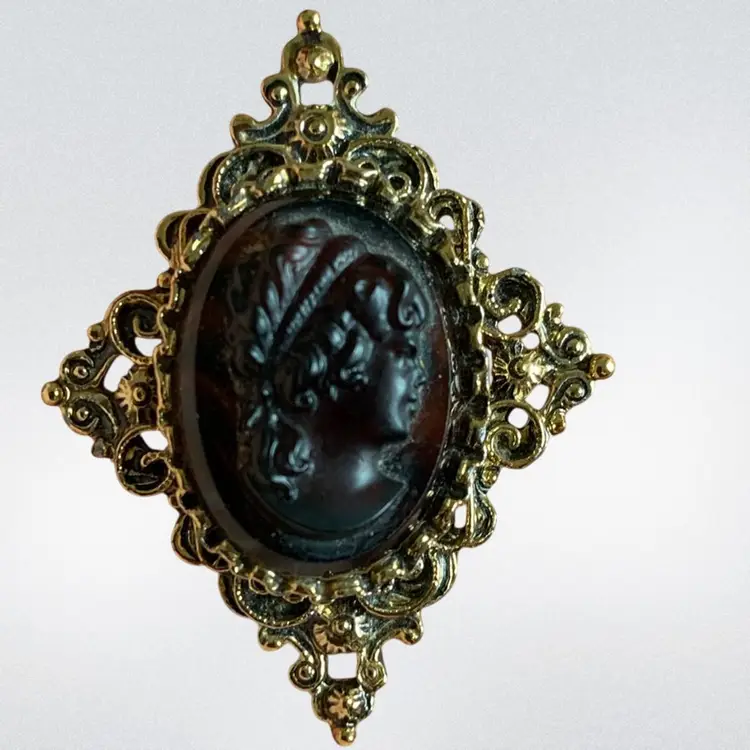 GERRY’S Gold Tone Black  Resin Cameo  On Brown Stripped Glass Set In A Diamond Gold Tone Filigree Brooch