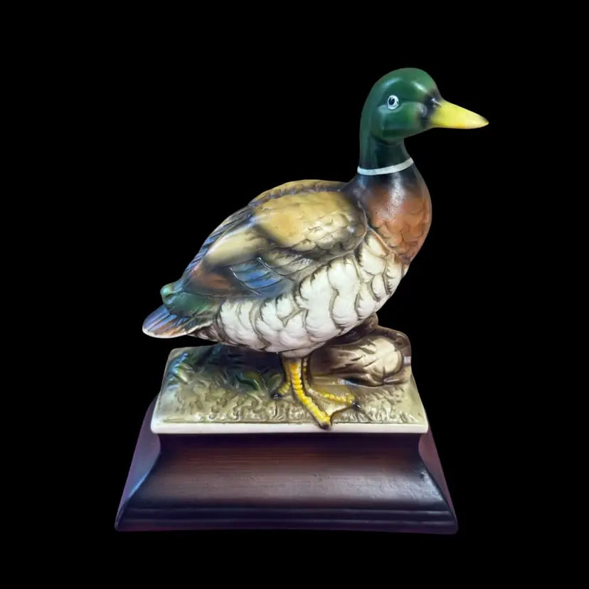 Vintage porcelain mallard duck figurine on a Porcelain base.