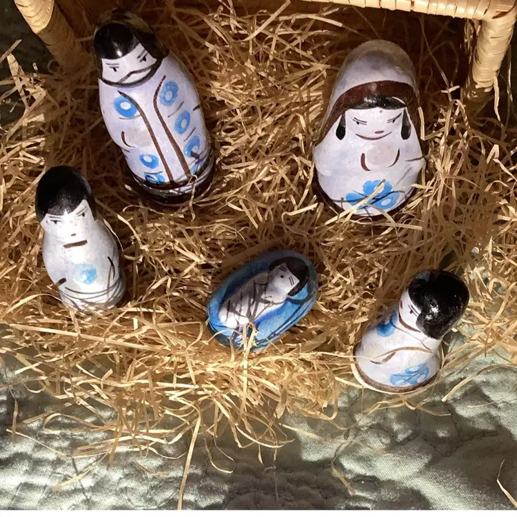 Porcelain nativity scene in a basket