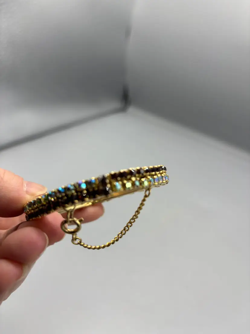 Gold tone bangle with 2 tone rhinestone