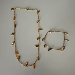 Avon Gold Toned Leaf Necklace And Bracelet