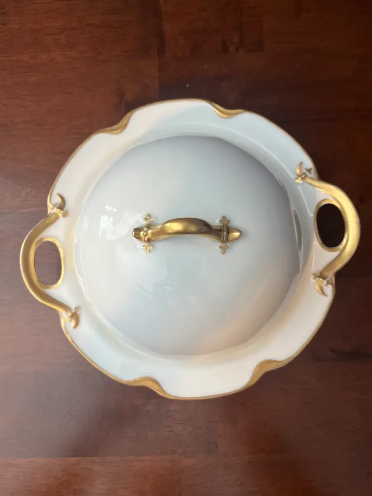 A vintage Haviland Limoges porcelain serving dish and bowl with gold trim.