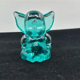 Teal Glass Elephant Sitting With Hands On Hips