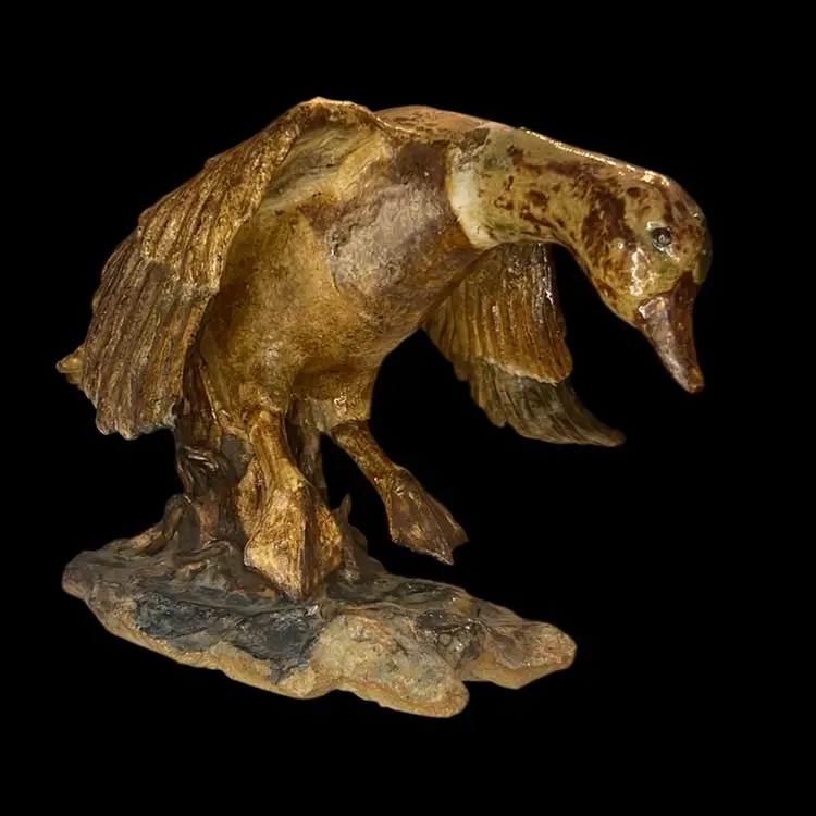 Duck In Flight Sculpture