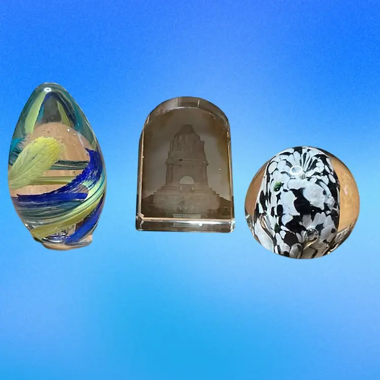 02. Hold your paper set of three paper weights.