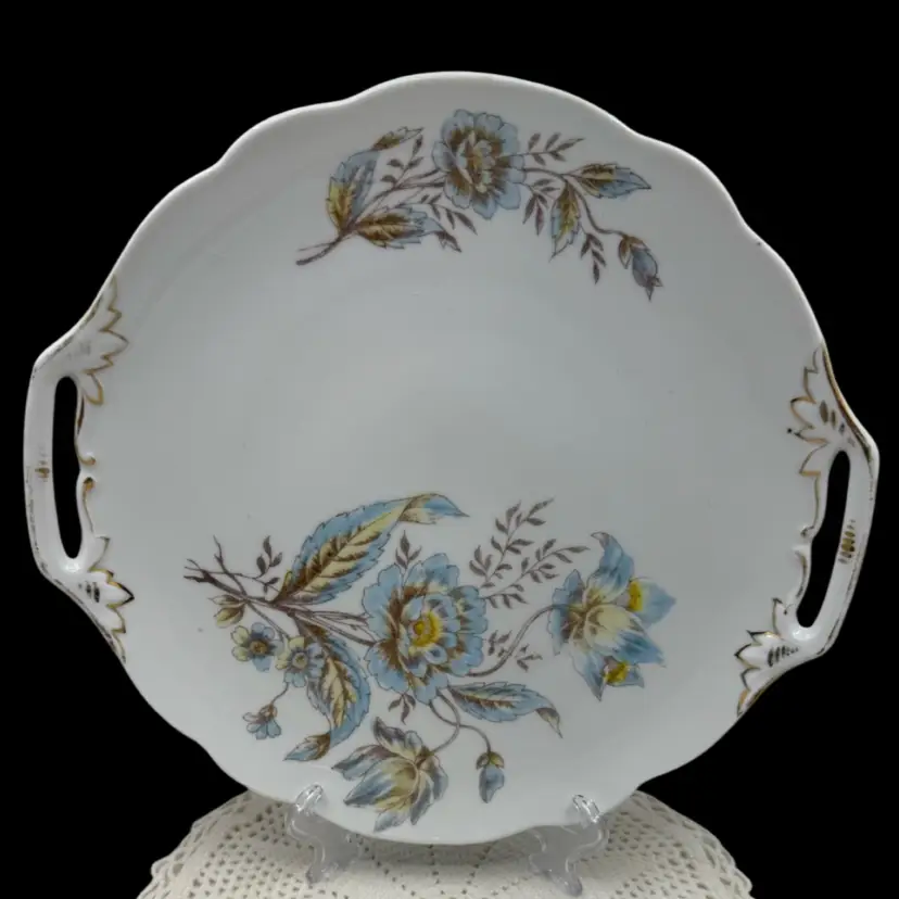 White ceramic cake plate with blue floral pattern and gold trim, 10”, Some Paint Wear On Handles