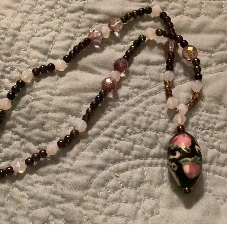 # 17 .  Oval Focal Point hand painted could be closing a not sure I think the beads might glow in the dark claw class