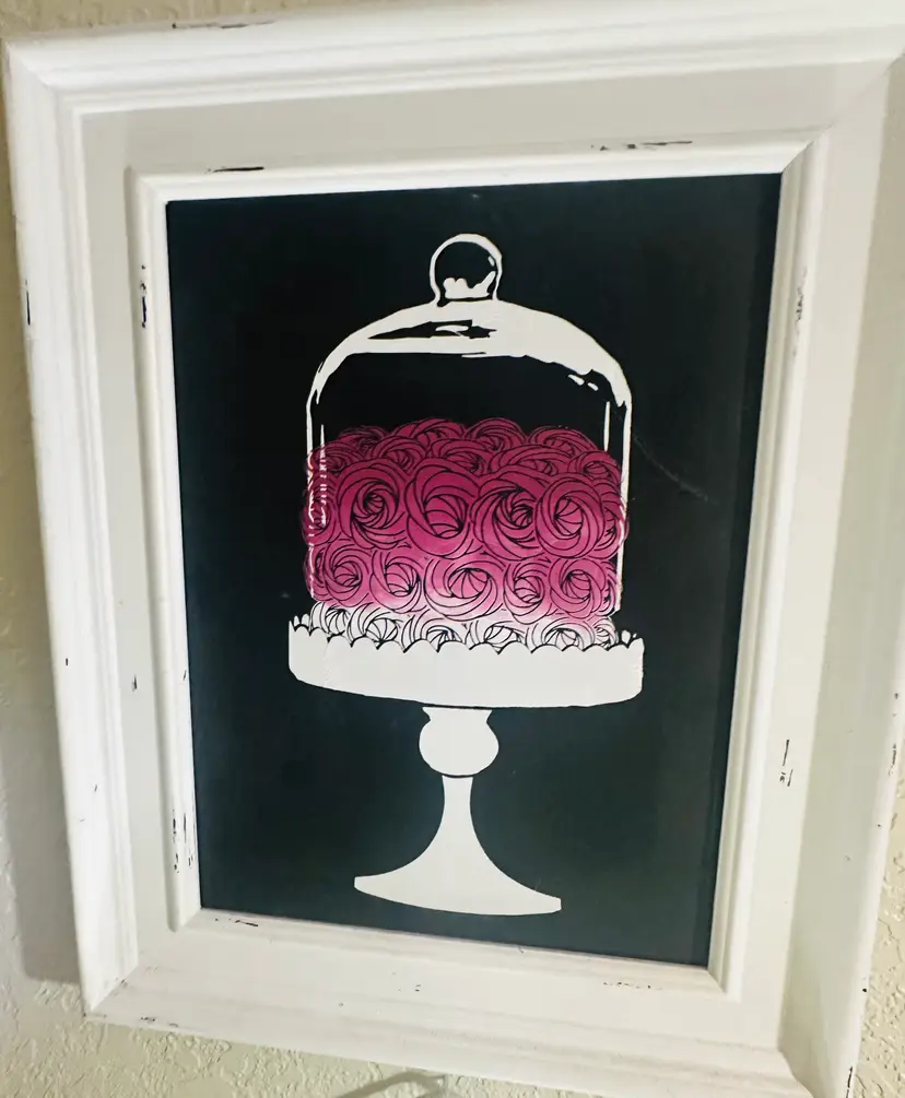 75. Rosette cake under a glass cloche.