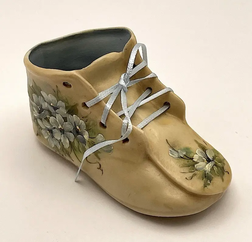 Hand painted, miniature, porcelain, baby shoe with blue flowers and blue ribbon, signed