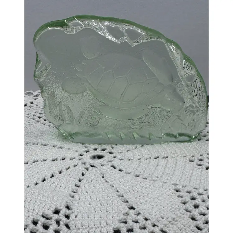 A vintage molded green glass sea turtle figurine or paperweight.