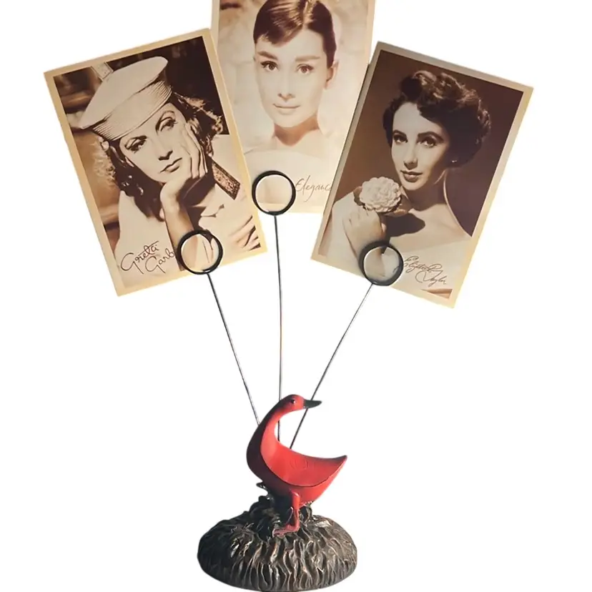 Solid & Heavy Red Duck With 3 Metal Posts To Hold Photographs.
The Base Is Brown To Represent Dirt.