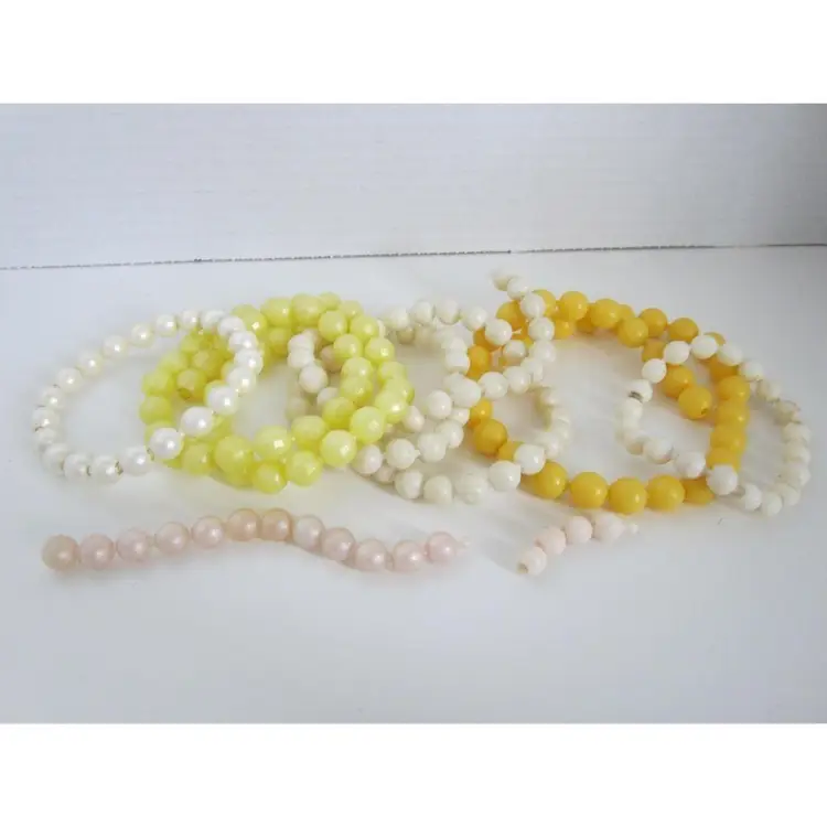 1950's POP BEADS - 176 beads in yellow, orange and ivory tones