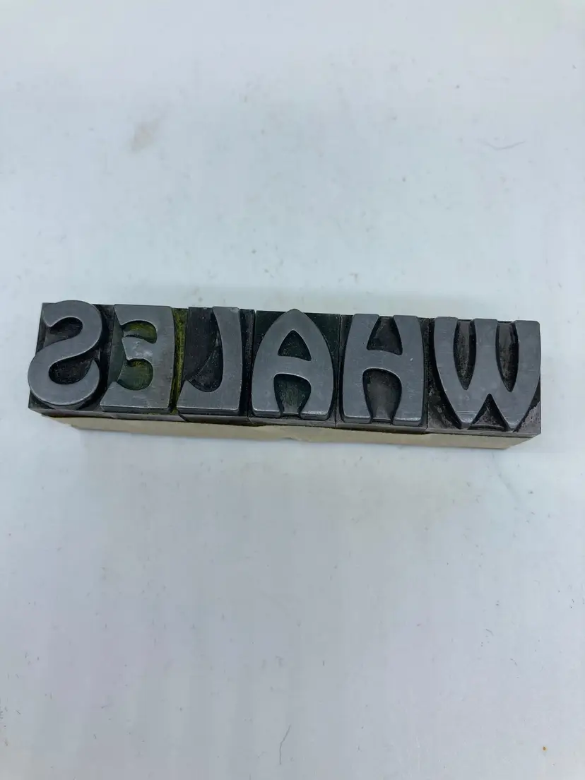 Whale Stamping Letters