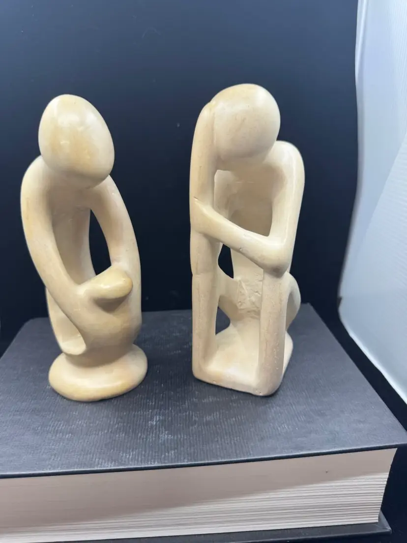 Pair of abstract carved soapstone figural sculptures