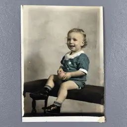 Vintage Early 1900s Studio Portrait Photo Child Sitting On A Bench With Toy Color-Tinted Blue