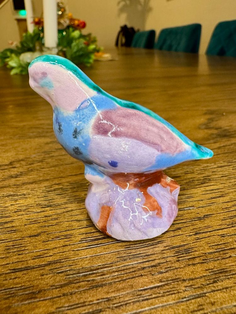 Mini ceramic bird figurine, likely from the Wolfe Studio in Jackson, Mississippi.
Abstract ceramic painting