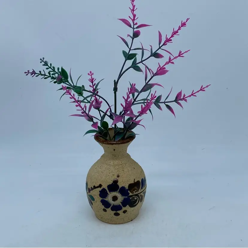 #3032 Small speckled stoneware vase with blue floral decoration from Tonala, Mexico Signed 4”