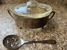 #01 Vintage Pyrex casserole dish in a decorative silver-plated holder with Vintage Sheffield England Silver Plated Slotted Serving Spoon Acorn Design 8"