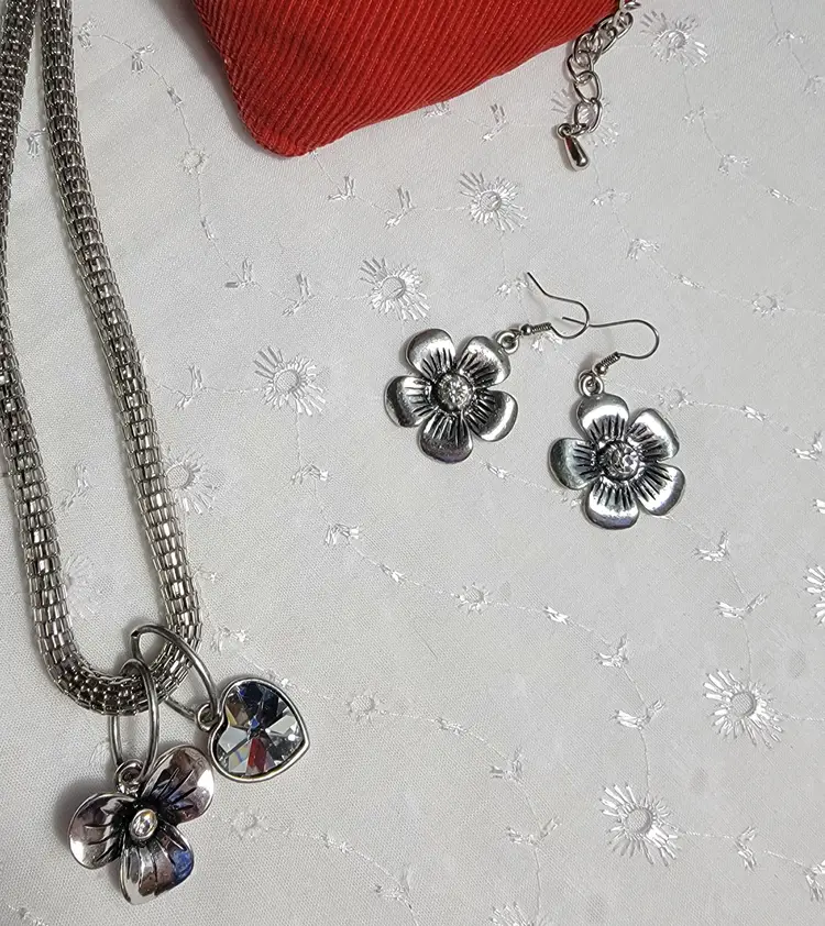 Silvertone mesh chain with rhinestone amd flower charms and earrings