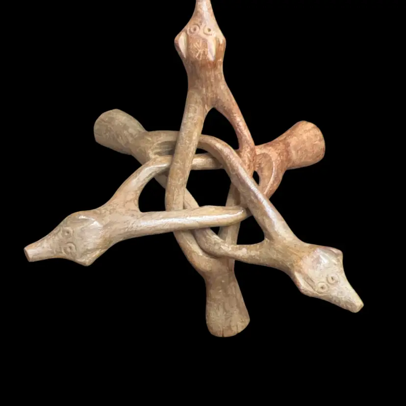 Unique Wood Paperweight Stand. vintage, hand-carved wooden display stand, often referred to as a "cobra stand" or interlocking reptile stand, designed to hold items like Paperweights