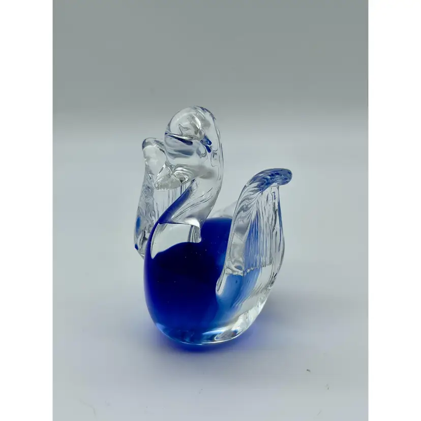 Small cobalt and clear art glass duck paperweight with applied wings.