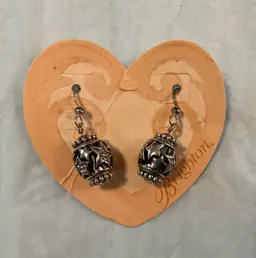 #01 Brighton shimmering star earrings with crystal on end. They drop 1 1/4”.