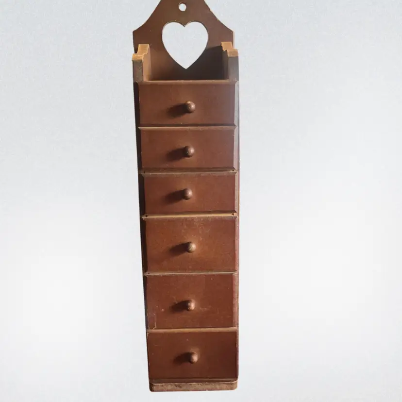 Vintage wooden wall box with six drawers and heart cutout. 16”