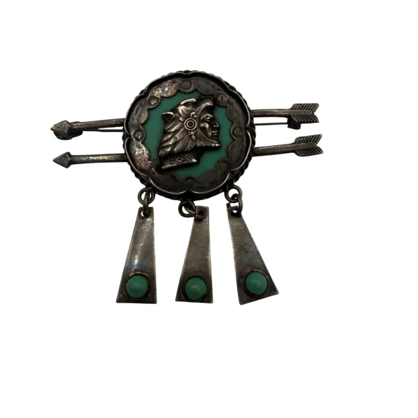 Signed vintage Mexican sterling silver brooch featuring an Aztec warrior motif with green inlay
