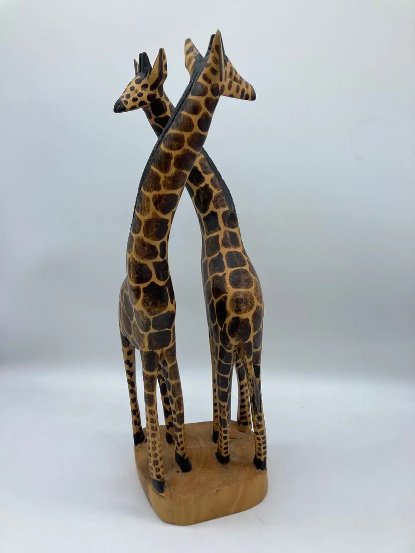 Twin carved wood giraffes figurines