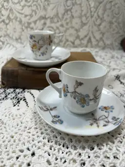 A Pair Of French Limoges Espresso, Cups, And Saucers One Saucers, Chipped