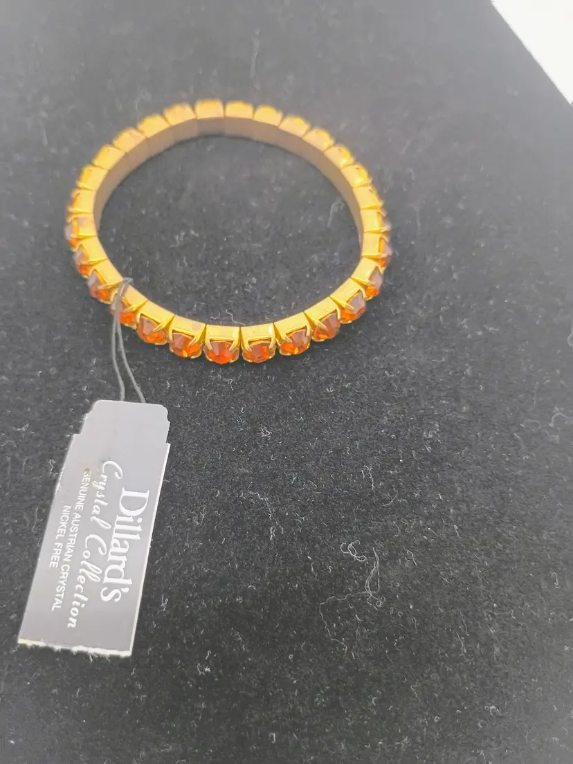 Dillard's Genuine Austrian Crystal Stretch Bracelet Gold Tone Amber Crystals. Brand new