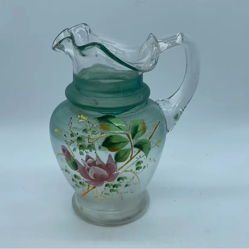 #1215 Vintage hand-painted frosted green glass pitcher with floral decoration. 7”