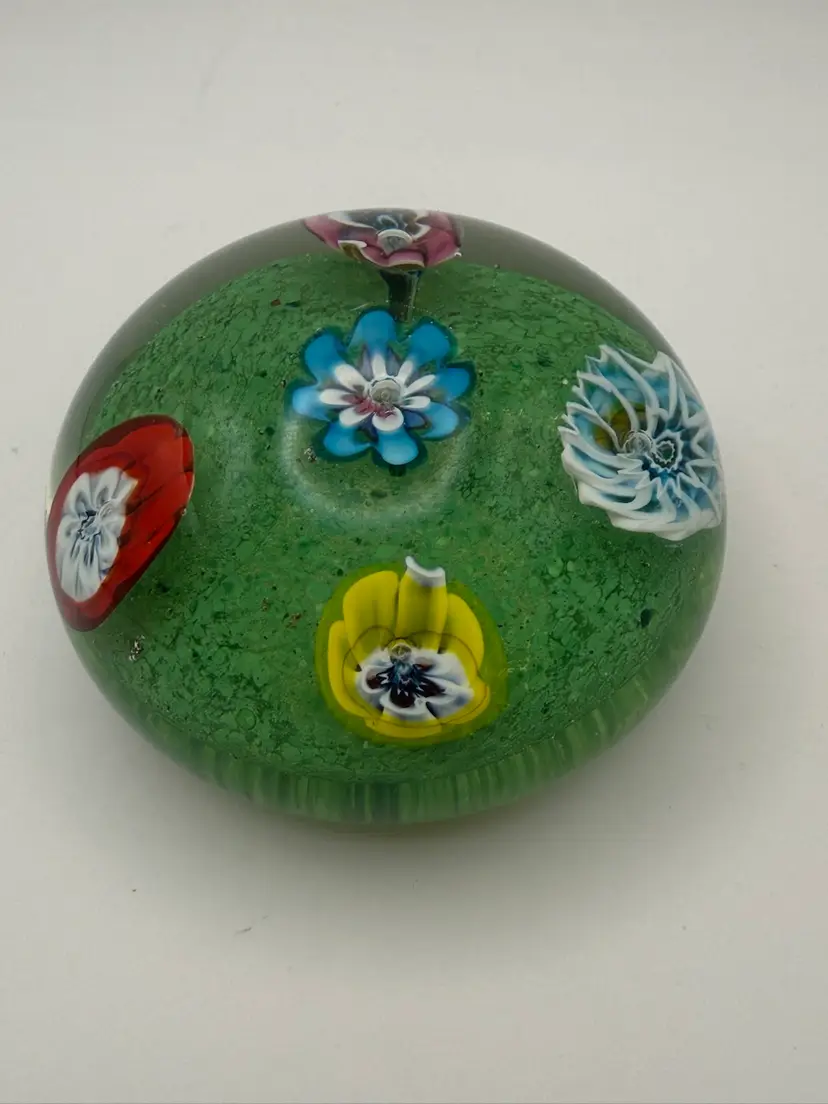Old Murano glass paperweight with a floral murines design