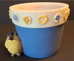 Spring Flower Pot with Flower Trim and a Yellow Bird