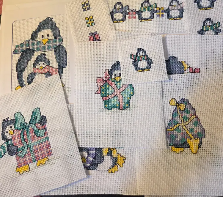 Lot of 11 Cross-stitched pieces Penguin Christmas themed New