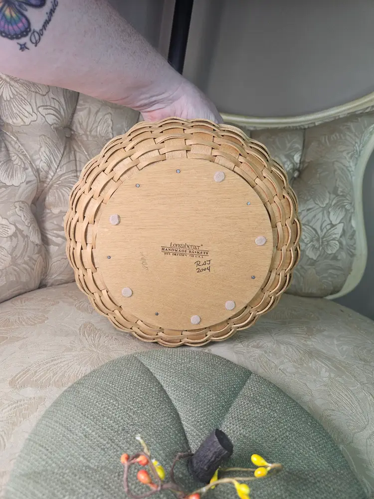 Longaberger pumpkin-themed basket with a green fabric lid.